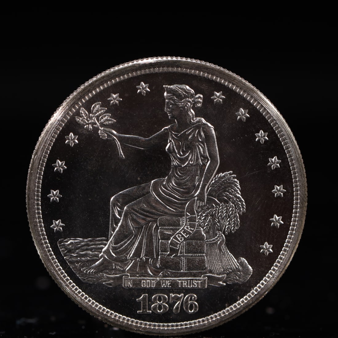 USA Trade Dollar 1876 Coin: American coin. Obverse: Liberty seated on a pedestal facing the sea to the left holding olive branches surrounded by 13 stars. IN GOD WE TRUST / LIBERTY / 1876. Reverse: An eagle holding branches