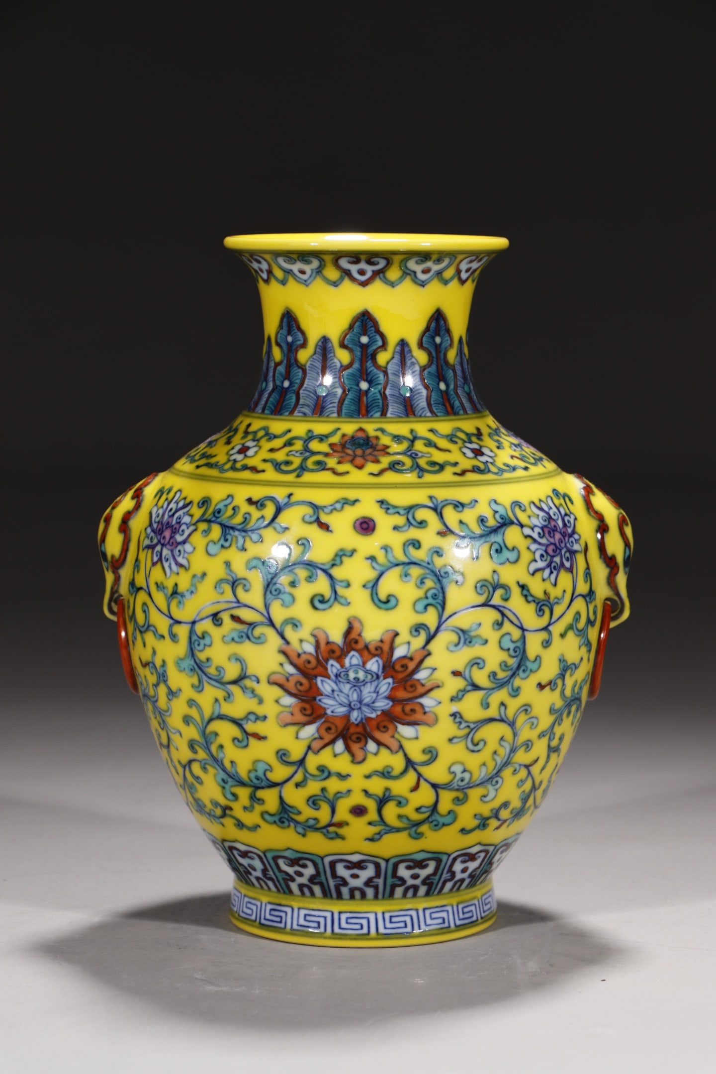 An Exquisite Yellow Ground Doucai Lotus Pattern Beast-Ears Vase: An Exquisite Yellow Ground Doucai Lotus Pattern Beast-Ears Vase,Qing Dynasty,China,Qianlong Six-character Mark,Size:7.1in 