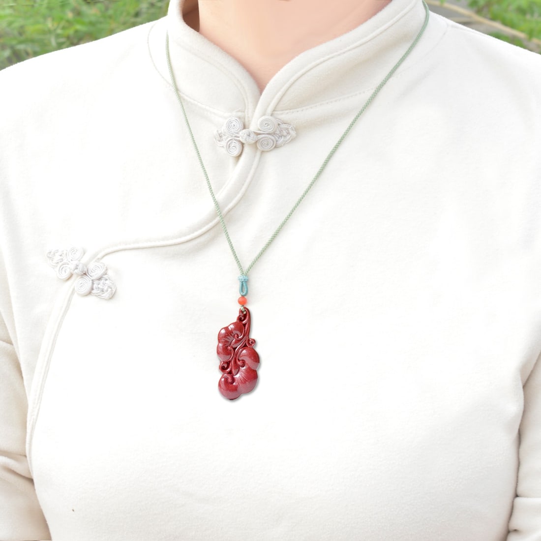 An Exquisite Cinnabar Ruyi Pendant (1 of 6)