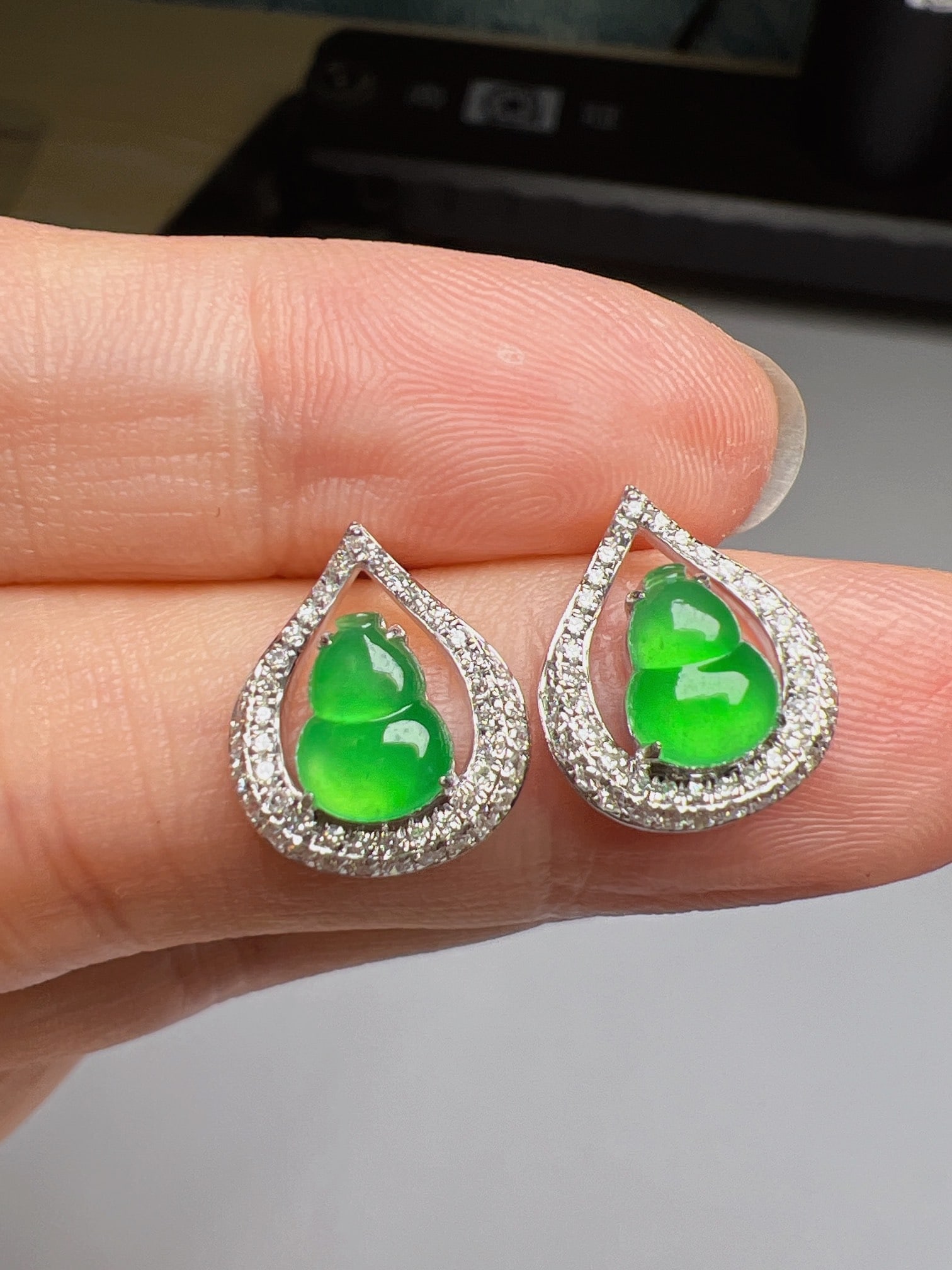 A Pair of Exquisite 18k Gold Diamond Inlaid Jadeite Earrings: A Pair of Exquisite 18k Gold Diamond Inlaid Jadeite Earrings,Size(Loose Stone):0.3inx0.2in 一对18k金钻镶嵌翡翠耳钉