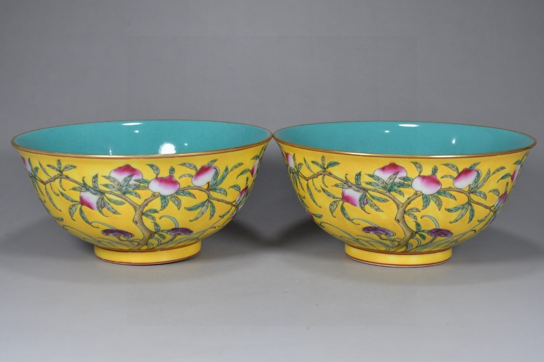 A Pair of Exquisite Famille-Rose Yellow Ground Painted Gold Flower and Fruit Pattern Bowls: A Pair of Exquisite Famille-Rose Yellow Ground Painted Gold Flower and Fruit Pattern Bowls,Qing Dynasty, China,Qianlong Six-character Mark,Size:3.1inx6.7in 一对粉彩黄