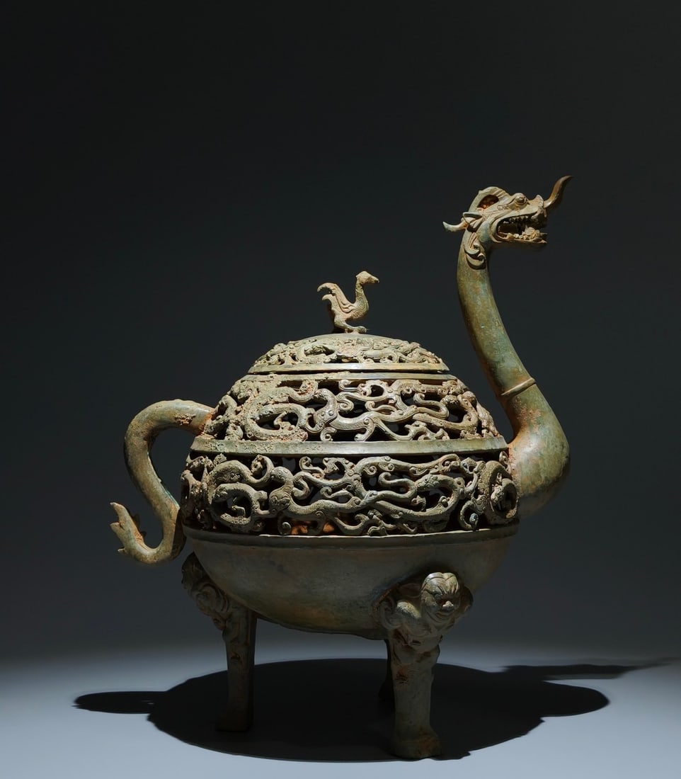 An Archaic Bronze Coiling Dragon Pattern Hollow Dragon-Shaped Tripod Censer,With Inscription: An Archaic Bronze Coiling Dragon Pattern Hollow Dragon-Shaped Tripod Censer,With Inscription,the Warring States period in China,Size:15inx12.6inx8.7in 