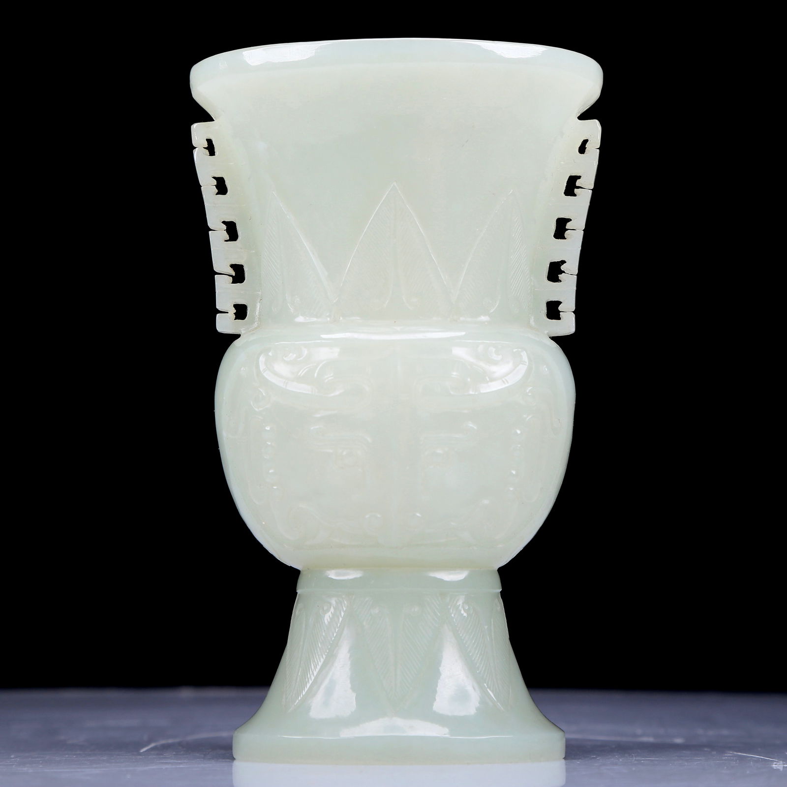 A Precious White Jade 'Animal Mask' Vase: A Precious White Jade 'Animal Mask' Vase. Supported on a splayed foot. Chinese Qing Dynasty. Size:3.1inx2.2inx5.1in. Weight:210g 清代 白玉兽面纹瓶