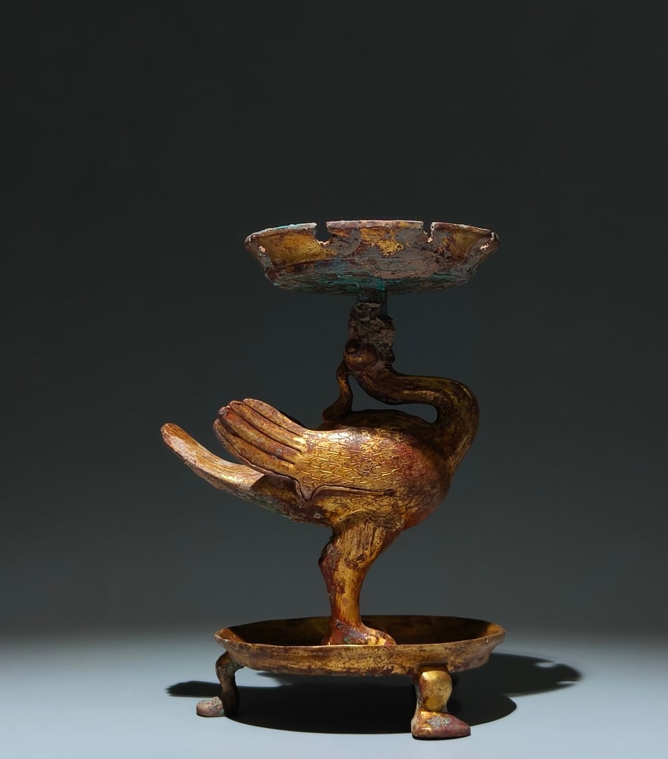 An Exquisite Gilt Bronze Bird-Shaped Tripod Candlestick: An Exquisite Gilt Bronze Bird-Shaped Tripod Candlestick,Han Dynasty, China,Size:8.1inx5.9inx4.9in 