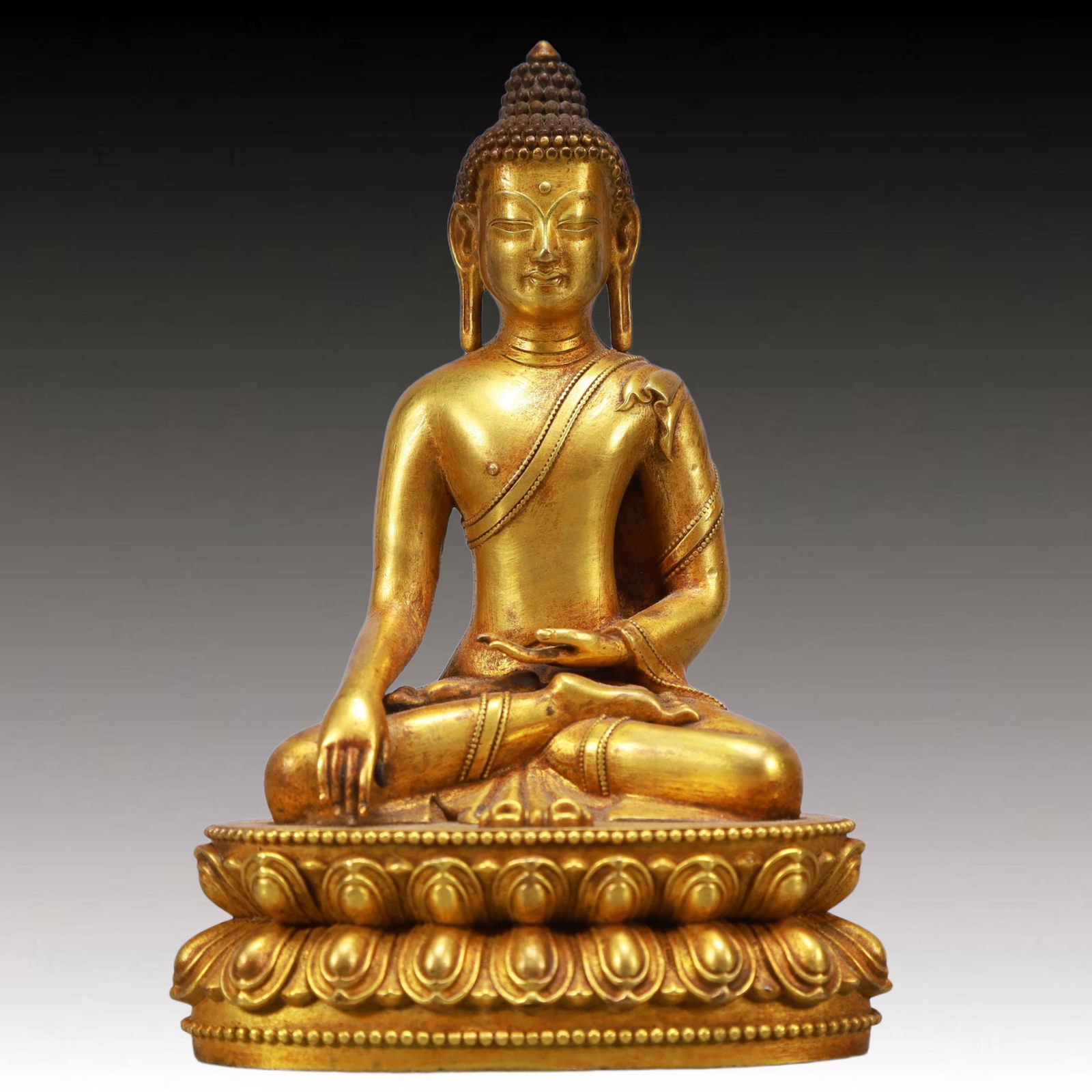 A Solemn Gilt Bronze Statue of Sakyamuni: A Solemn Gilt Bronze Statue of Sakyamuni,Qing Dynasty, China,Size:3.9inx2.8inx5.9in,Weight:750g 铜鎏金如来像,中国清代