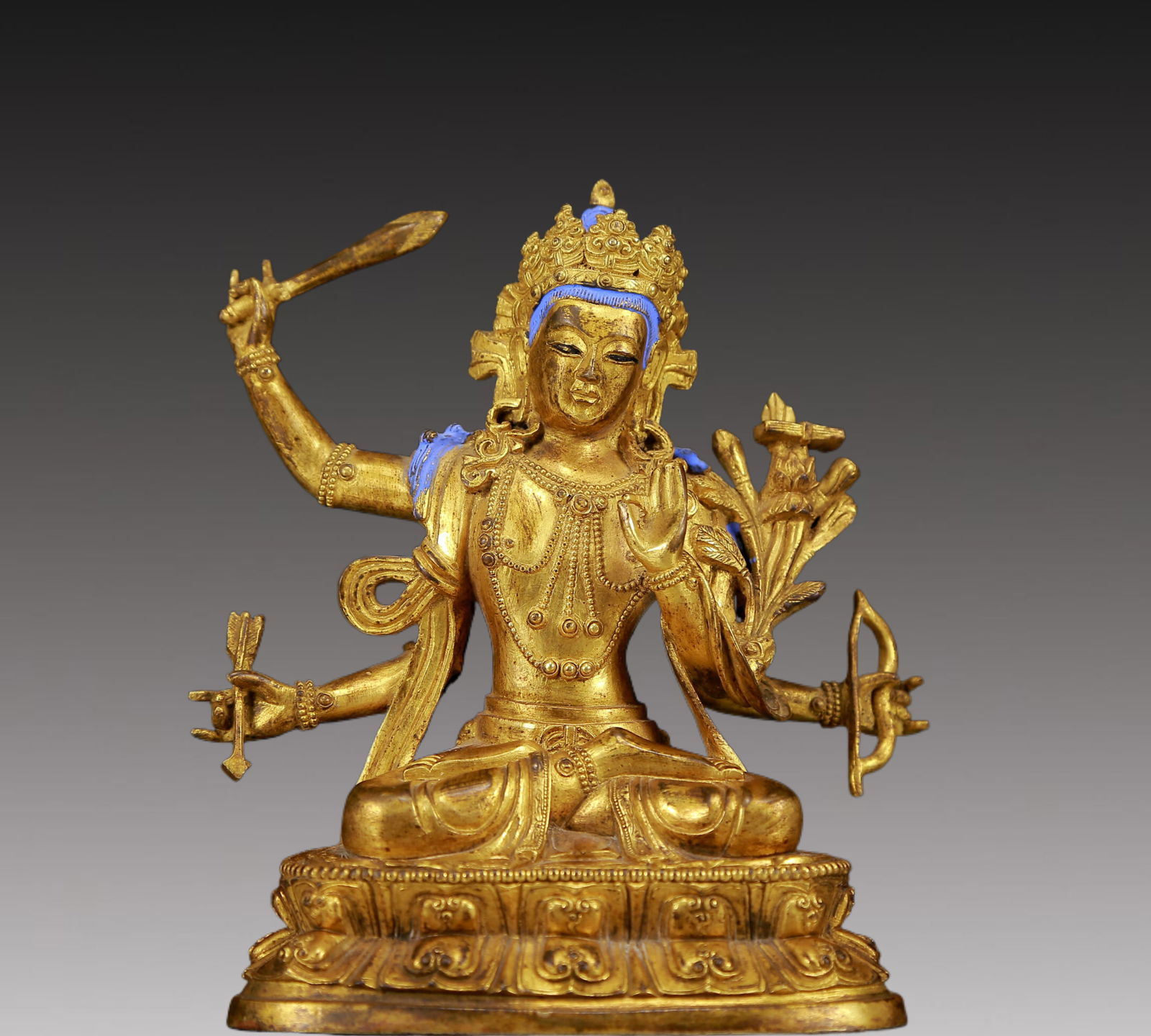 An Exquisite Gilt Bronze Statue of Four-Armed Manjusri: An Exquisite Gilt Bronze Statue of Four-Armed Manjusri,Ming Dynasty, China,Size:4.3inx3.1inx5.5in,Weight:870g 铜鎏金四臂文殊菩萨像，&#