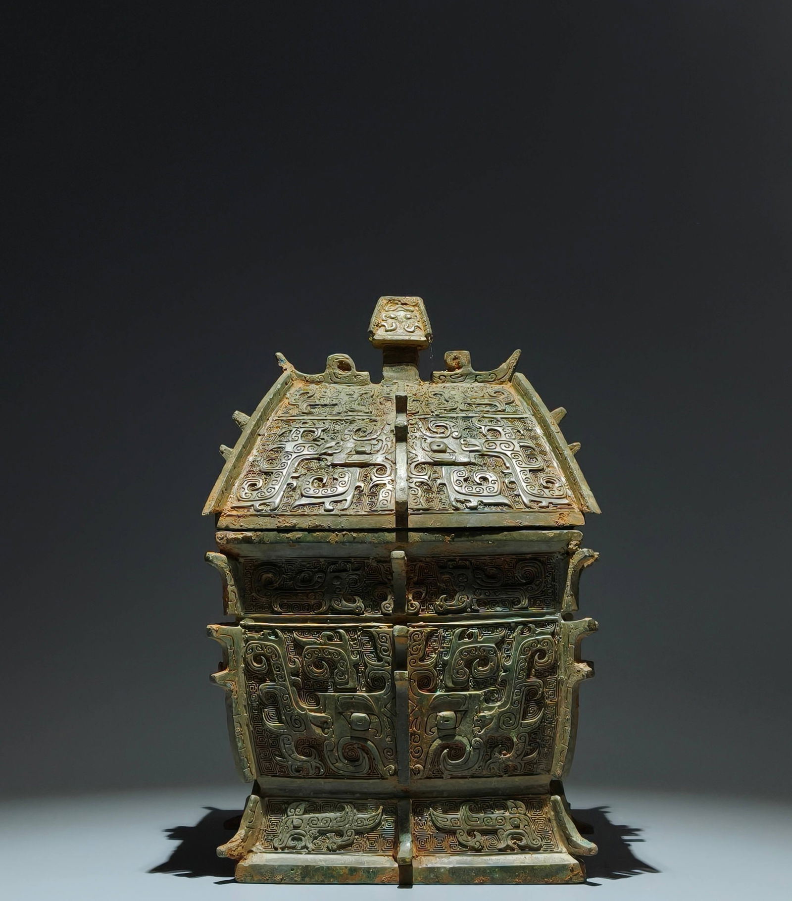 An Archaic Bronze Beast-Face Pattern Food Vessel: An Archaic Bronze Beast-Face Pattern Food Vessel,Sang Dynasty,China,Size:14.6inx9.4inx7.5in 青铜兽面纹食器,中国商代