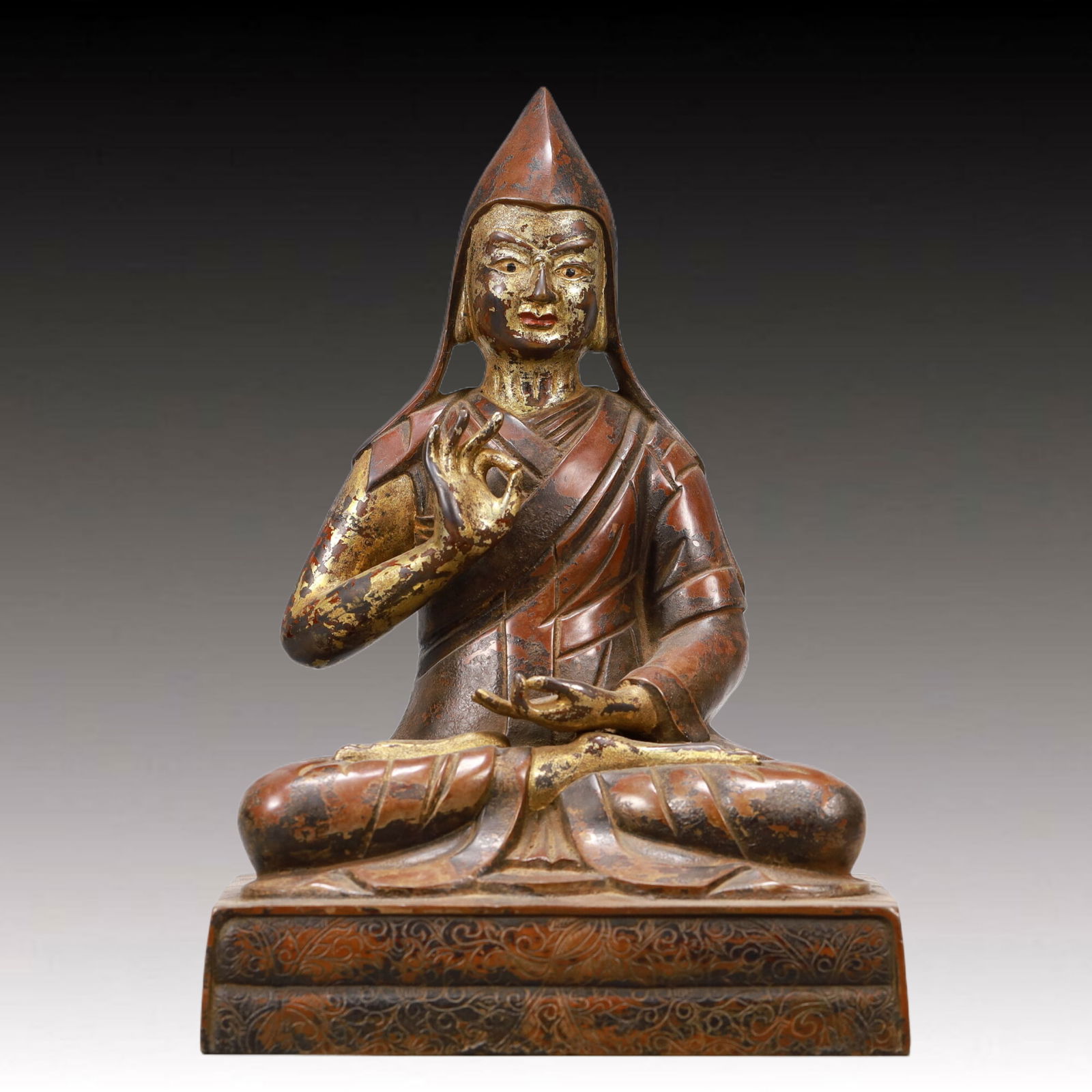 An Excellent Gilt-Bronze Figure Of Tsongkapa: An Excellent Gilt-Bronze Figure Of Tsongkapa. The figure with a dignified expression is rendered clad in long,flowing robes,the voluminous drapery elegantly cascading in folds,topknot surmounted by a