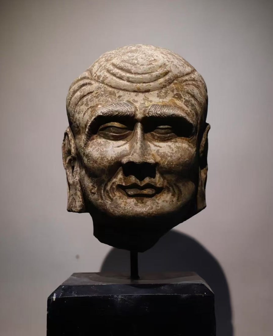 A Solemn Limestone Arhat-Head Ornament: A Solemn Limestone Arhat-Head Ornament,Tang Dynasty, China,Size:19.7in 