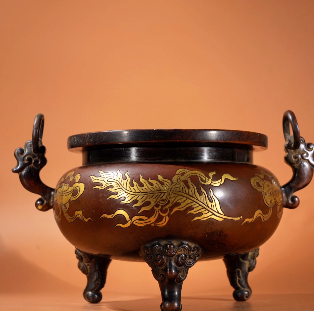 An Exquisite Gilt Bronze Eight Treasures Pattern Double-Ears and Tripod Censer: An Exquisite Gilt Bronze Eight Treasures Pattern Double-Ears and Tripod Censer,Ming Dynasty, China,Xunde Six-character Mark,Size:5.1inx5.4in,Weight:2485g 