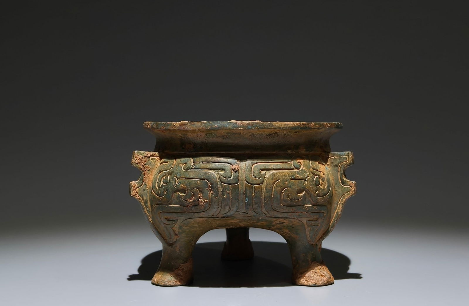 An Archaic Bronze Chi-Dragon Pattern Four Legs Food Vessel,With Inscription: An Archaic Bronze Chi-Dragon Pattern Four Legs Food Vessel,With Inscription,W.Zhou , China,Size:4.3inx5.9in 