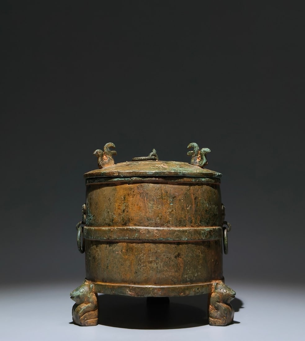 An Archaic Bronze Phoenix Pattern Beast-Ears Tripod Food Vessel: An Archaic Bronze Phoenix Pattern Beast-Ears Tripod Food Vessel,Han Dynasty, China,Size:7.9inx6.3in 青铜凤纹兽耳三足食器,中国