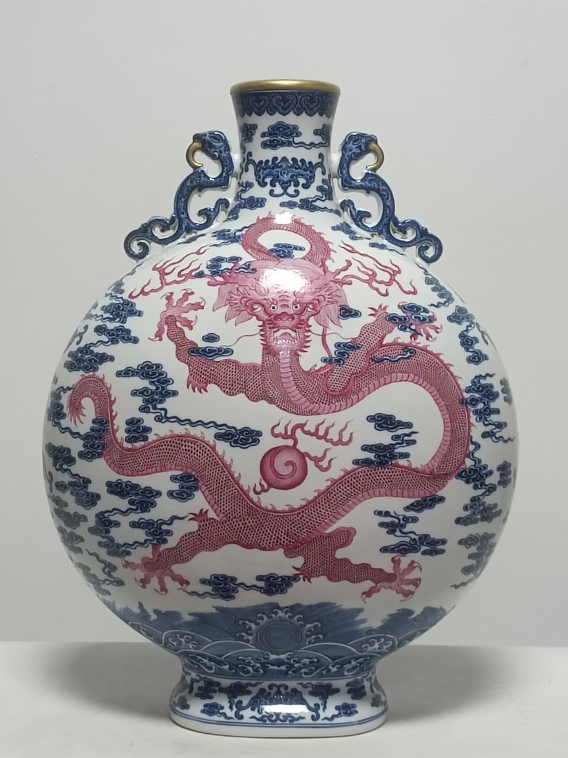 A Huge Blue and White Ruby red-Glazed Painted Gold Seawater Auspicious Cloud and Dragon Pattern: A Huge Blue and White Ruby red-Glazed Painted Gold Seawater Auspicious Cloud and Dragon Pattern Dragon-Ears Vase,Qing Dynasty,China,Qianlong Six-character Mark,Size:20.1inx15in 