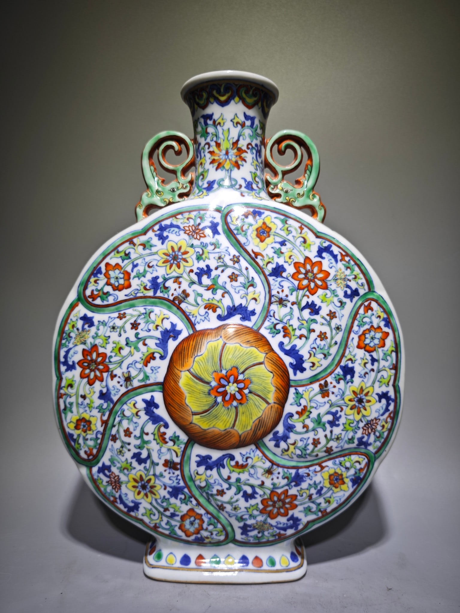 A Rare Doucai Flower Pattern Beast-Ears Vase: A Rare Doucai Flower Pattern Beast-Ears Vase,Qing Dynasty,China,Qianlong Six-character Mark,Size:12.7inx9.3in 