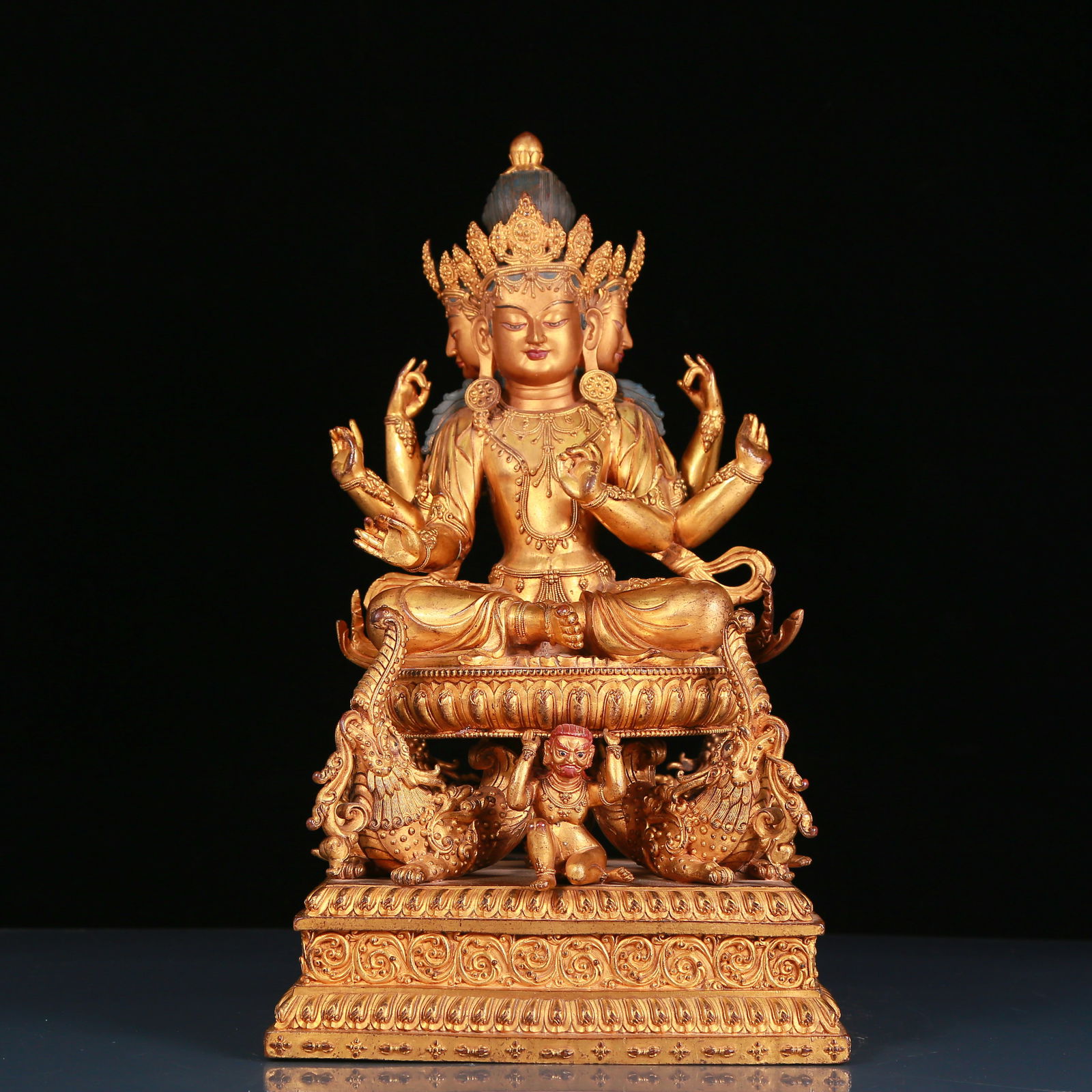 A solemn gilt bronze six-armed Guanyin statue (1 of 13)