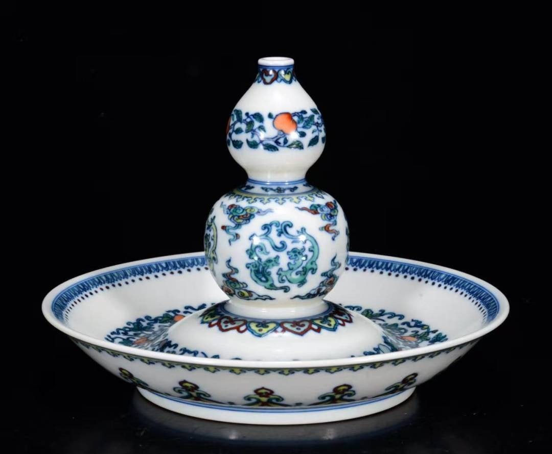 An Exquisite Doucai Bats and Peach Pattern Candlestick: An Exquisite Doucai Bats and Peach Pattern Candlestick,Qing Dynasty, China,Yongzheng Six-character Mark,Size:5.9inx8.3in 