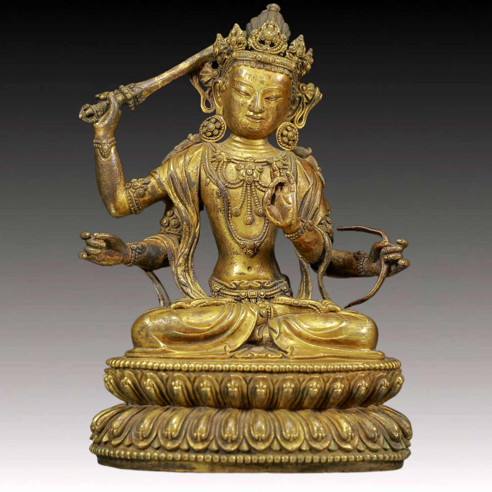 A Solemn Gilt Bronze Four-Armed Statue of Avalokitesvara: A Solemn Gilt Bronze Four-Armed Statue of Avalokitesvara,Ming Dynasty, China,Size: 5.5inx4.3inx8.3in,Weight:1840g 