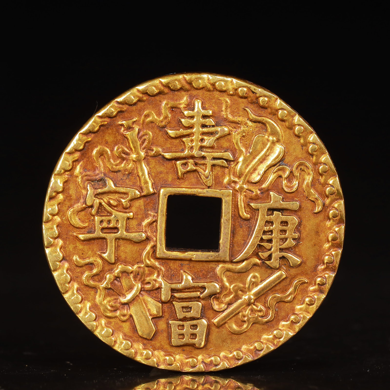 An Exquisite Gilt Bronze Eight Treasures Pattern Coin: An Exquisite Gilt Bronze Eight Treasures Pattern Coin,Ming Dynasty,China,Size:1.8inx0.2in,Weight:58g 铜鎏金八宝纹钱币,中国明代