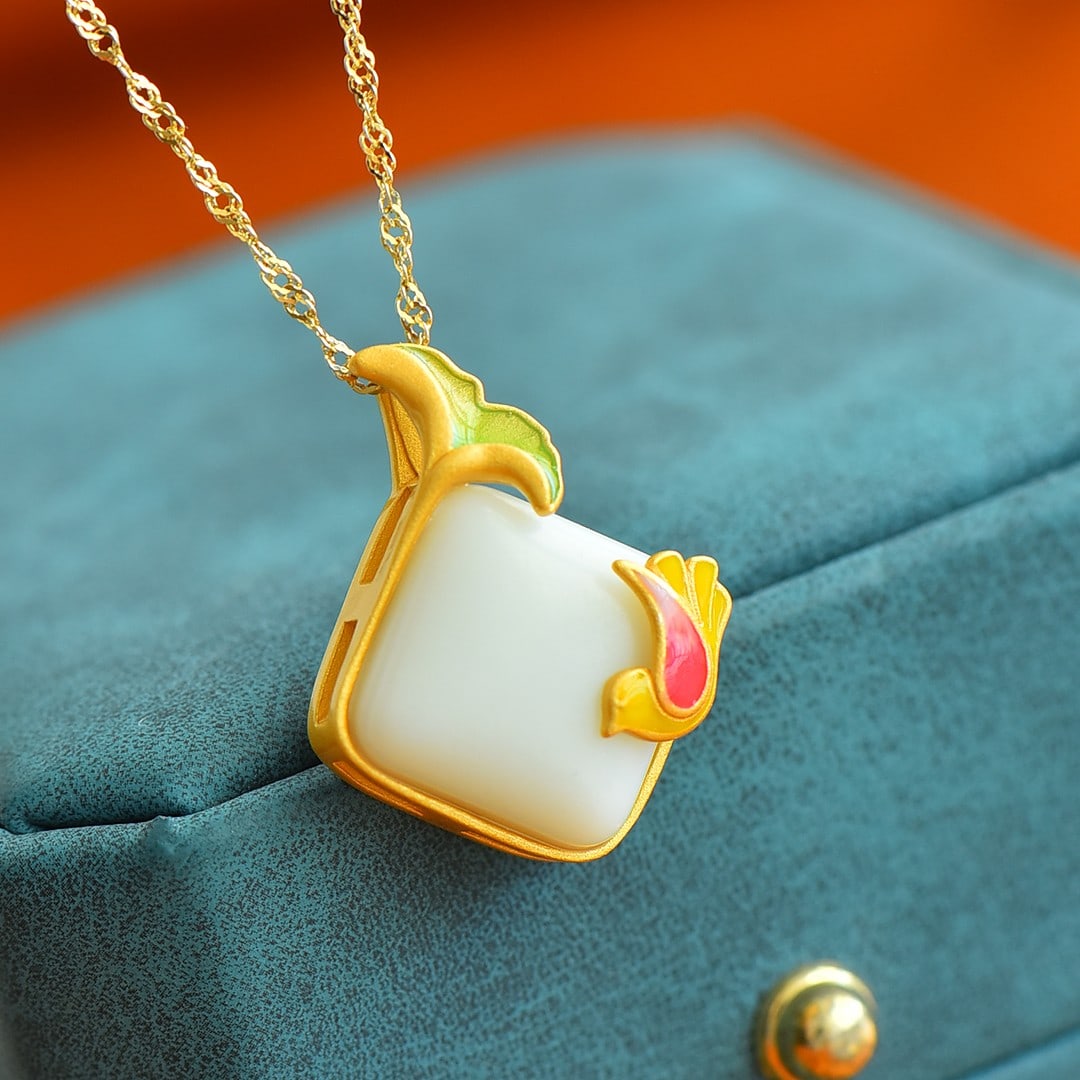 An Exquisite Sterling Silver-Gold Plated Inlaid White Jade Pendant: Sterling Silver-Gold Plated Inlaid White Jade Pendant , Size :14mmx14mm 纯银镀金镶白玉吊坠,尺寸:14mmx14mm