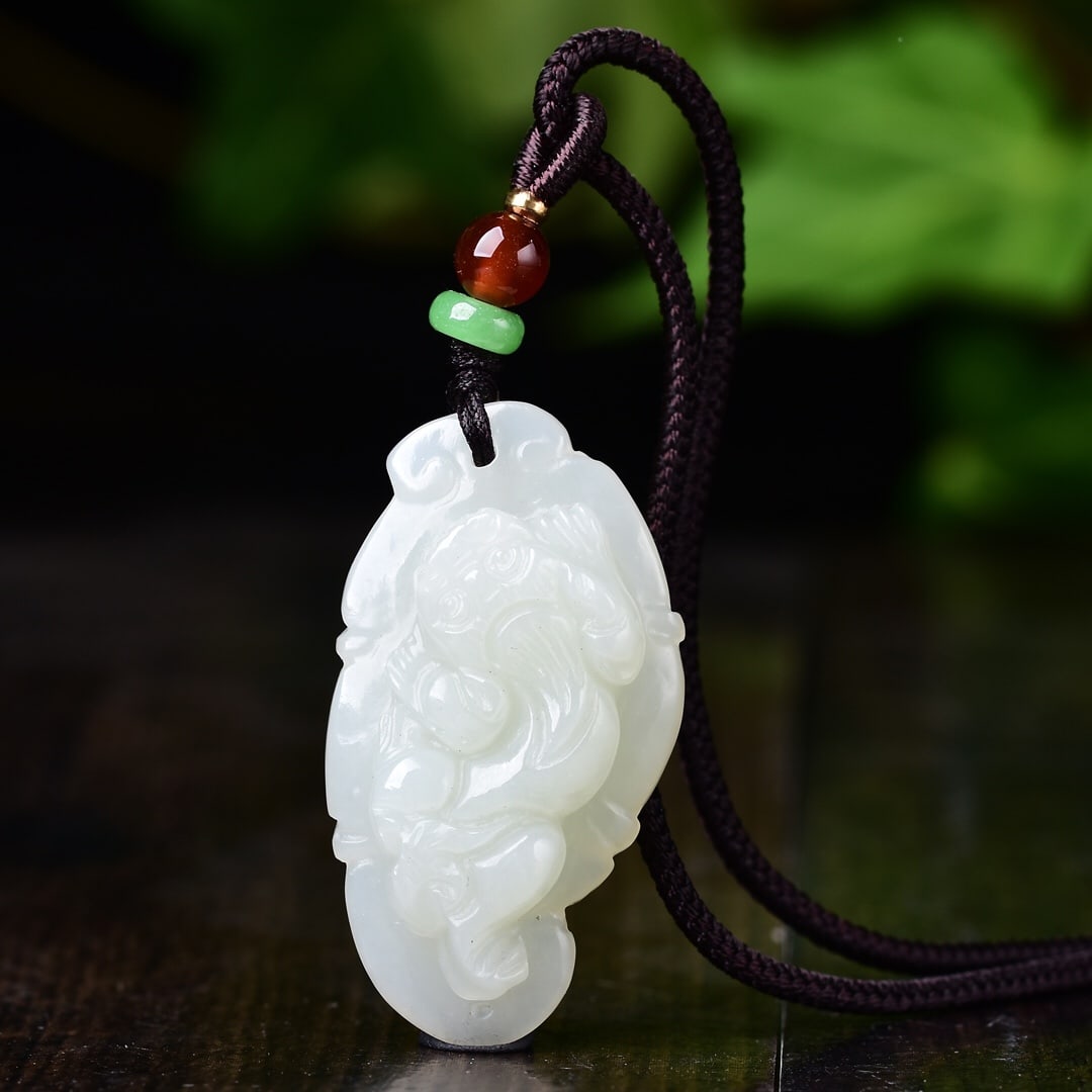 An Exquisite White Jade Auspicious Beast Pendant: An Exquisite White Jade Auspicious Beast Pendant,Size:22mmx41mm 白玉瑞兽吊坠