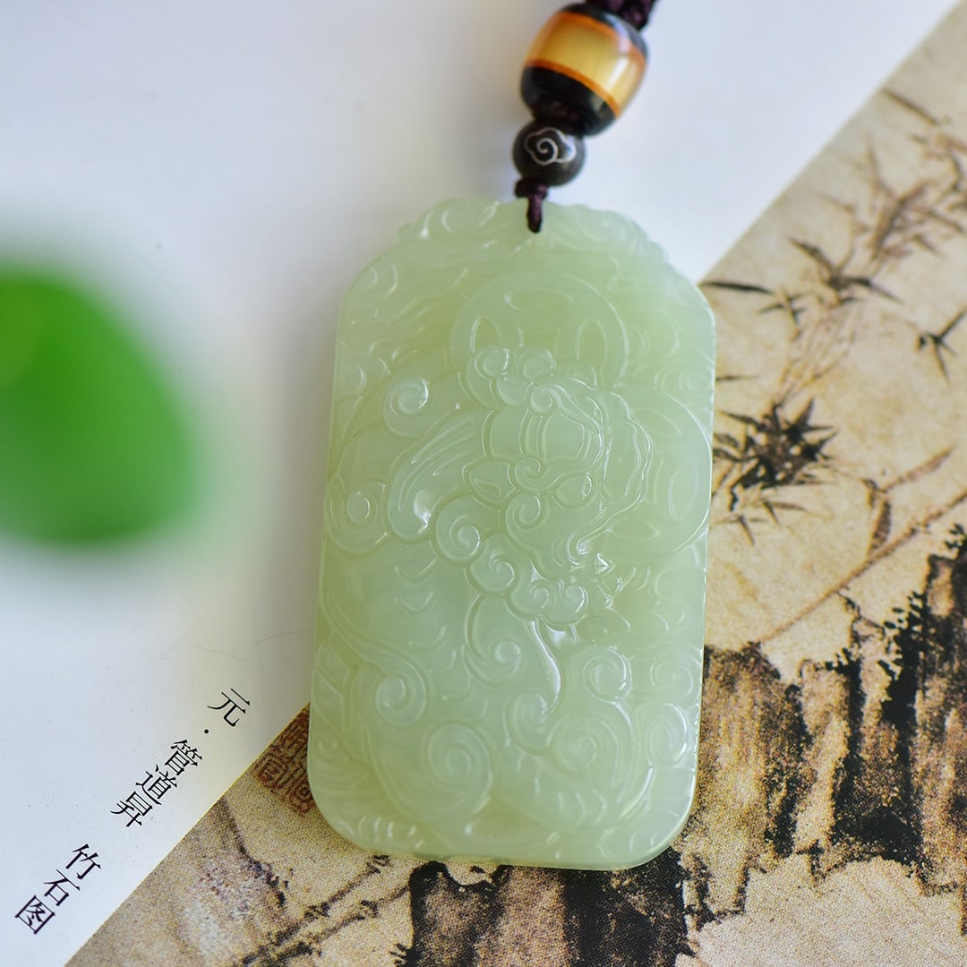 An Exquisite Greenish Jade Auspicious Beast Pattern Pendant: An Exquisite Greenish Jade Auspicious Beast Pattern Pendant,Size:32mmx57mm,Weight:37g 寓意:大吉大利 雕工精湛,玉质温润