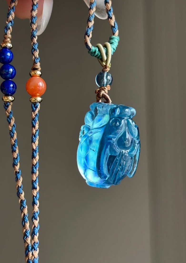 An Exquisite Aquamarine Auspicious Beast Pendant: An Exquisite Aquamarine Auspicious Beast Pendant,Size:23mmx15mmx13mm,Total Weight:9g 海蓝宝瑞兽吊坠