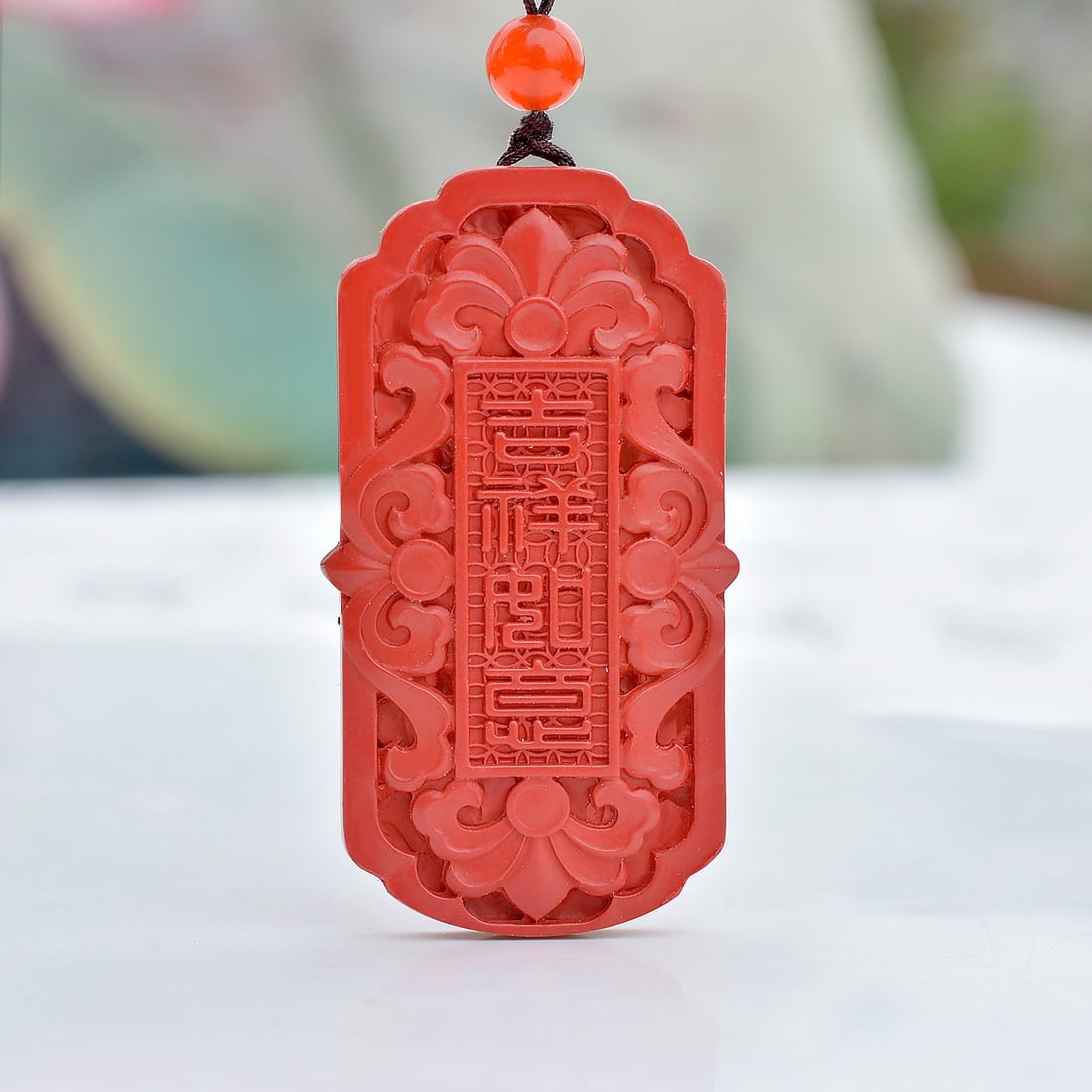 An Exquisite Cinnabar Flower Pattern Pendant: An Exquisite Cinnabar Flower Pattern Pendant,Size:21mmx39mm (寓意)吉祥招财喜庆、驱邪避凶、安神明&#