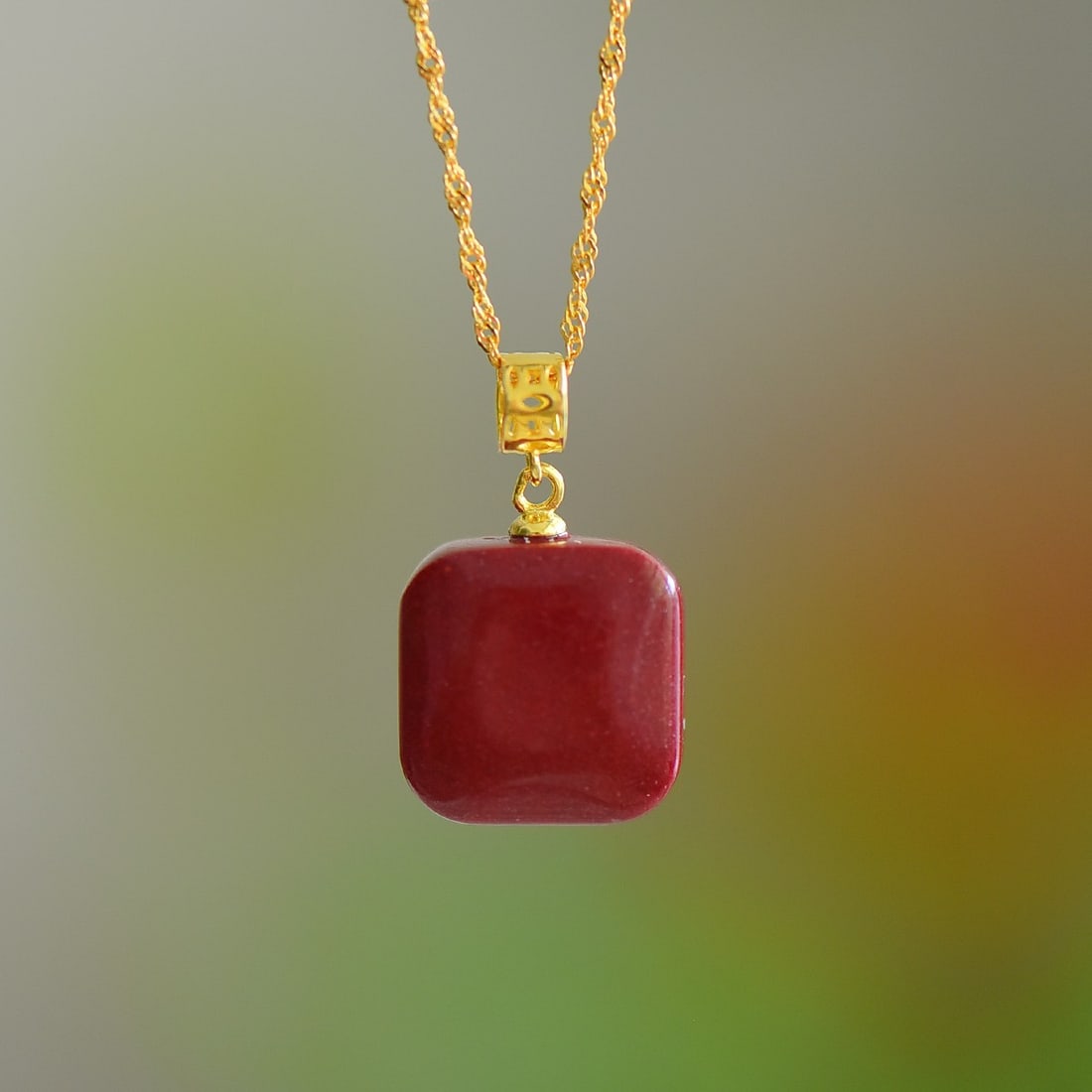An Exquisite Sterling Silver-Gold Plated Inlaid Cinnabar Pendant: An Exquisite Sterling Silver-Gold Plated Inlaid Cinnabar Pendant,Size:14mmx14mm 寓意:财源滚滚 