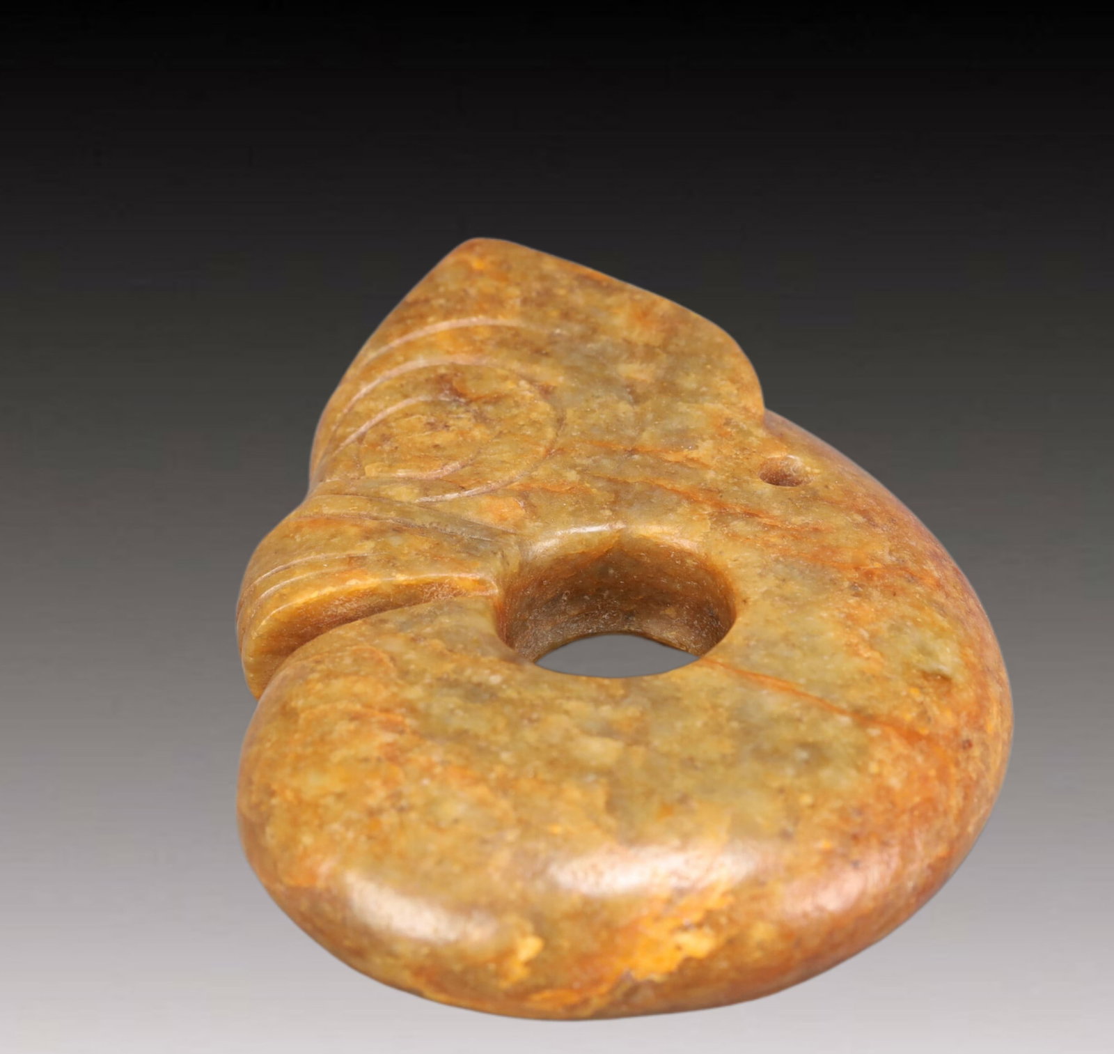 An Archaic Hongshan Culture Yellow Jade Pig and Dragon Ornament: An Archaic Hongshan Culture Yellow Jade Pig and Dragon Ornament,Ancient Time, China,Size:10.53cmx25cm Weight:850g 红山文化黄玉猪龙摆件,È