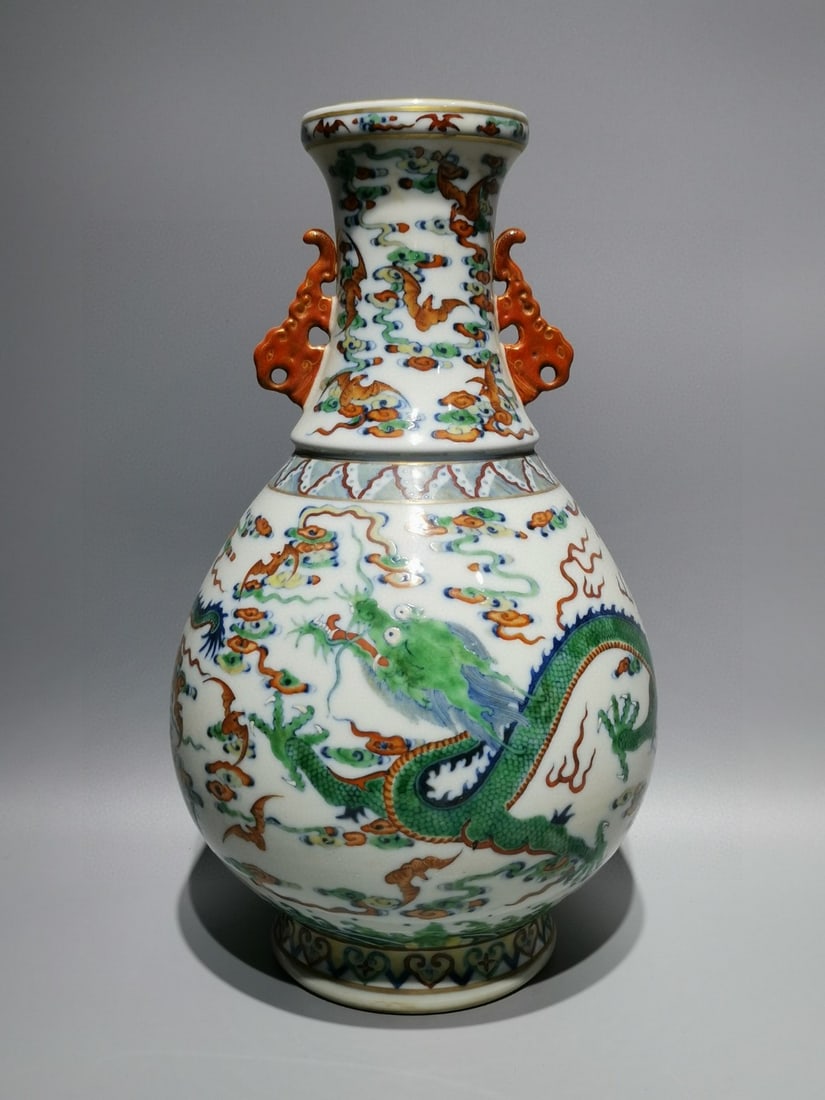 A Rare Doucai Painted Gold Auspicious Cloud and Dragon Pattern Double-Ears Vase: A Rare Doucai Painted Gold Auspicious Cloud and Dragon Pattern Double-Ears Vase,Qing Dynasty,China,Qianlong Six-character Mark,Size:13inx7.9in 斗彩描金祥云龙&
