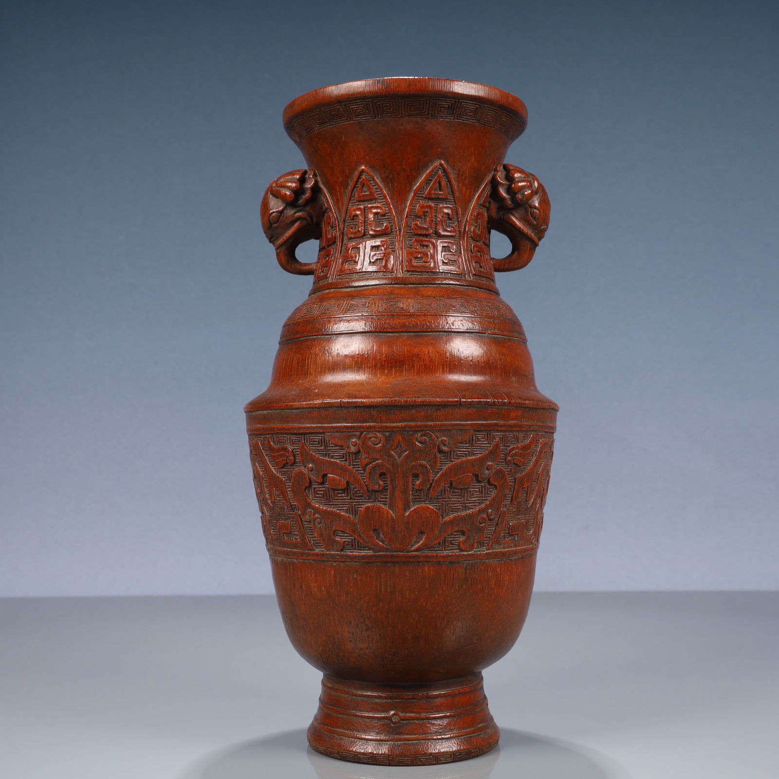 A Rare Bamboo Beast-Face Pattern Elephant-Ears Vase: A Rare Bamboo Beast-Face Pattern Elephant-Ears Vase,Qing Dynasty, China,Size:5.5inx11.8in,Weight:600g 竹雕兽面纹象耳瓶,中国清代