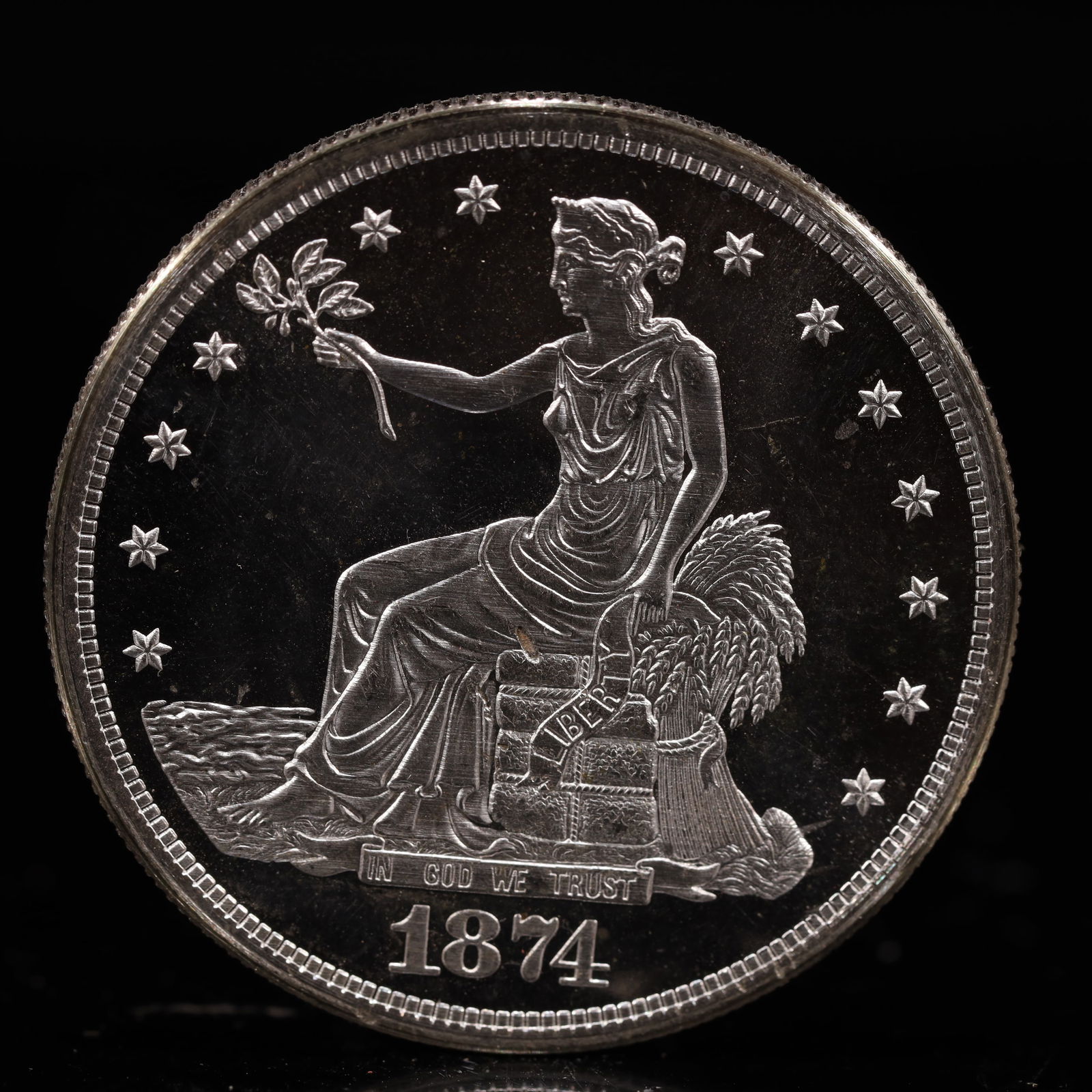 USA Trade Dollar 1874 Coin: American coin. Obverse: Liberty seated on a pedestal facing the sea to the left holding olive branches surrounded by 13 stars. IN GOD WE TRUST / LIBERTY / 1874. Reverse: An eagle holding branches with