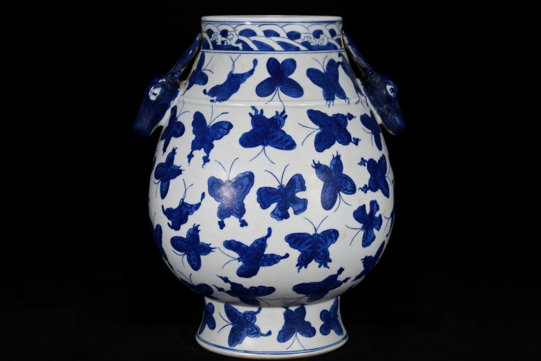 An Exquisite Blue and White Butterfly Pattern Deer-Ears Vase: An Exquisite Blue and White Butterfly Pattern Deer-Ears Vase,Qing Dynasty, China,Yongzheng Six-character Mark,Size:11.4inx9.4in 