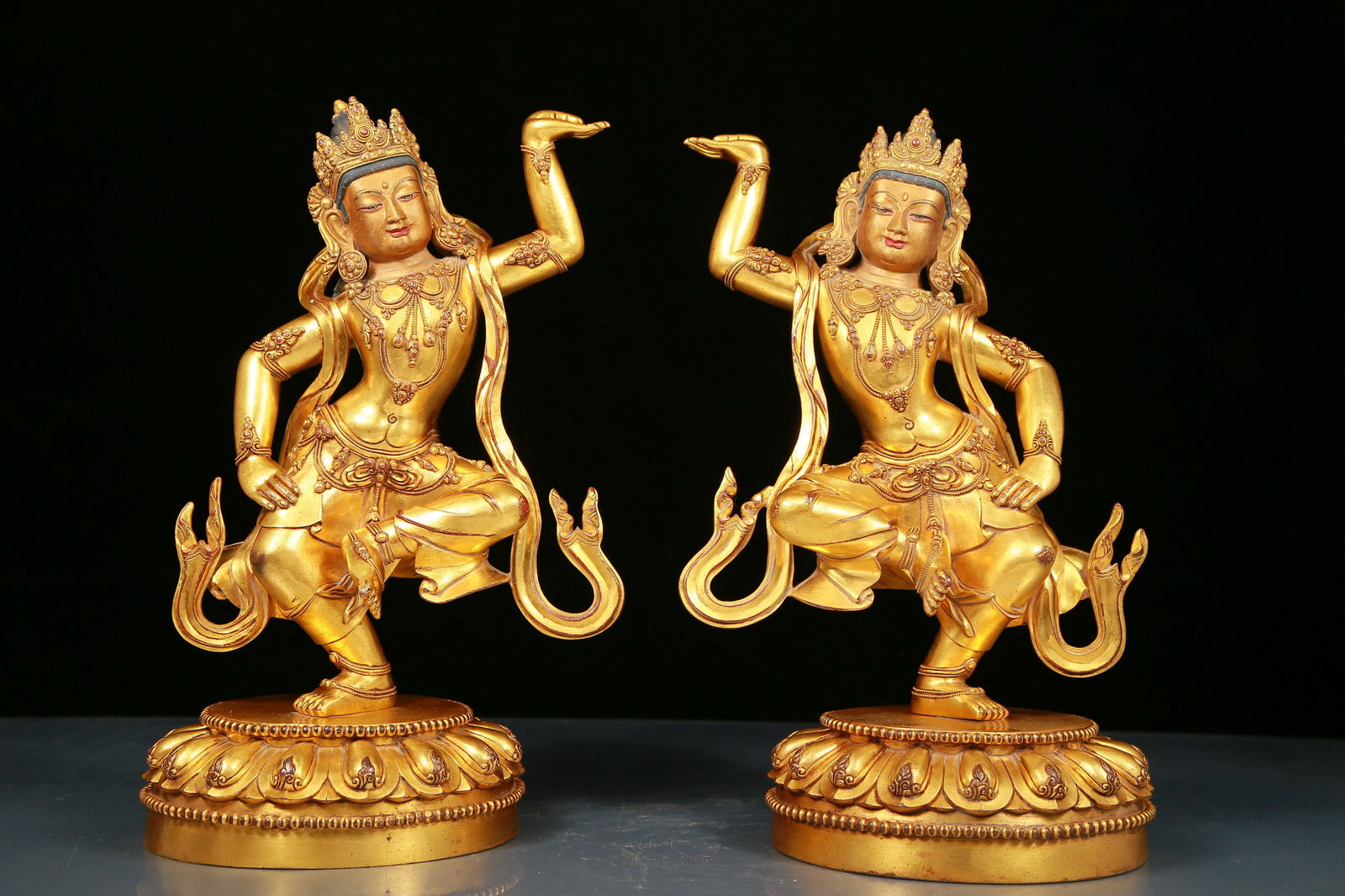 Two solemn gilt bronze Bodhisattva statues: Two solemn gilt-bronze Bodhisattva statues, Yongle six-character mark, Ming Dynasty, China. The statues are solemn, tall and majestic. The Bodhisattva is dressed in a gorgeous cassock, and the silk