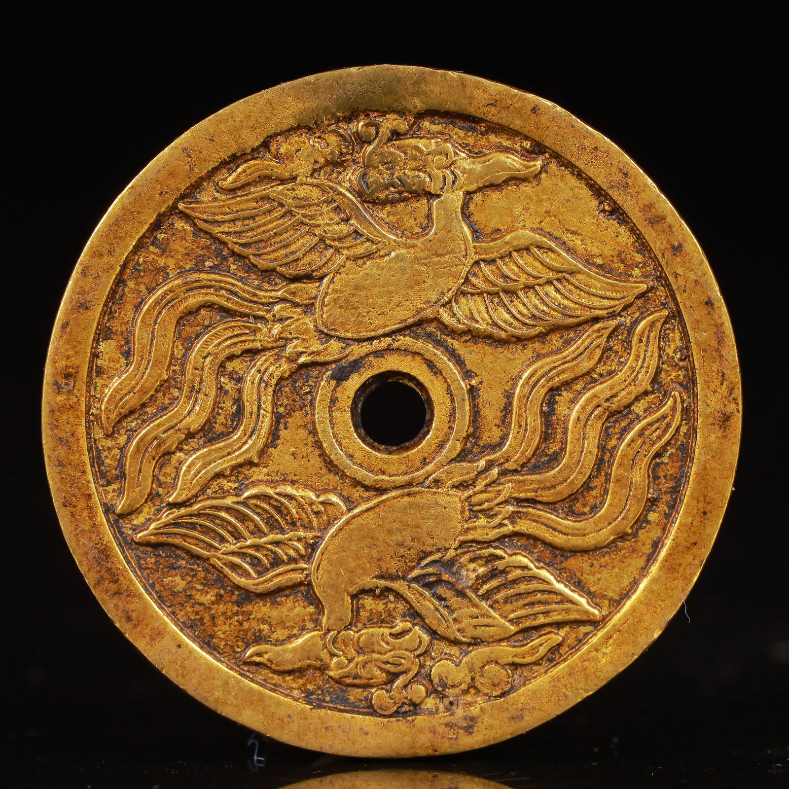 An Exquisite Gilt Bronze Phoenix Pattern Coin: An Exquisite Gilt Bronze Phoenix Pattern Coin,Liao Dynasty,China,Size:1.7inx0.1in,Weight:33g 铜鎏金凤纹钱币,中国辽代