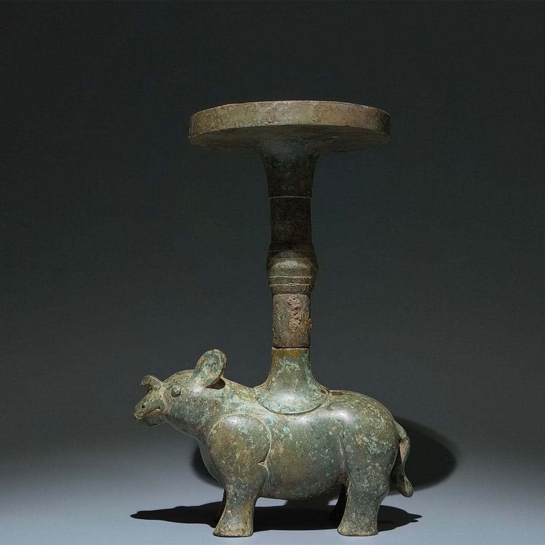An Archaic Bronze Auspicious Beast-Shaped Candlestick: An Archaic Bronze Auspicious Beast-Shaped Candlestick,the Warring States period in China,Size:12.6inx8.3inx3.1in 