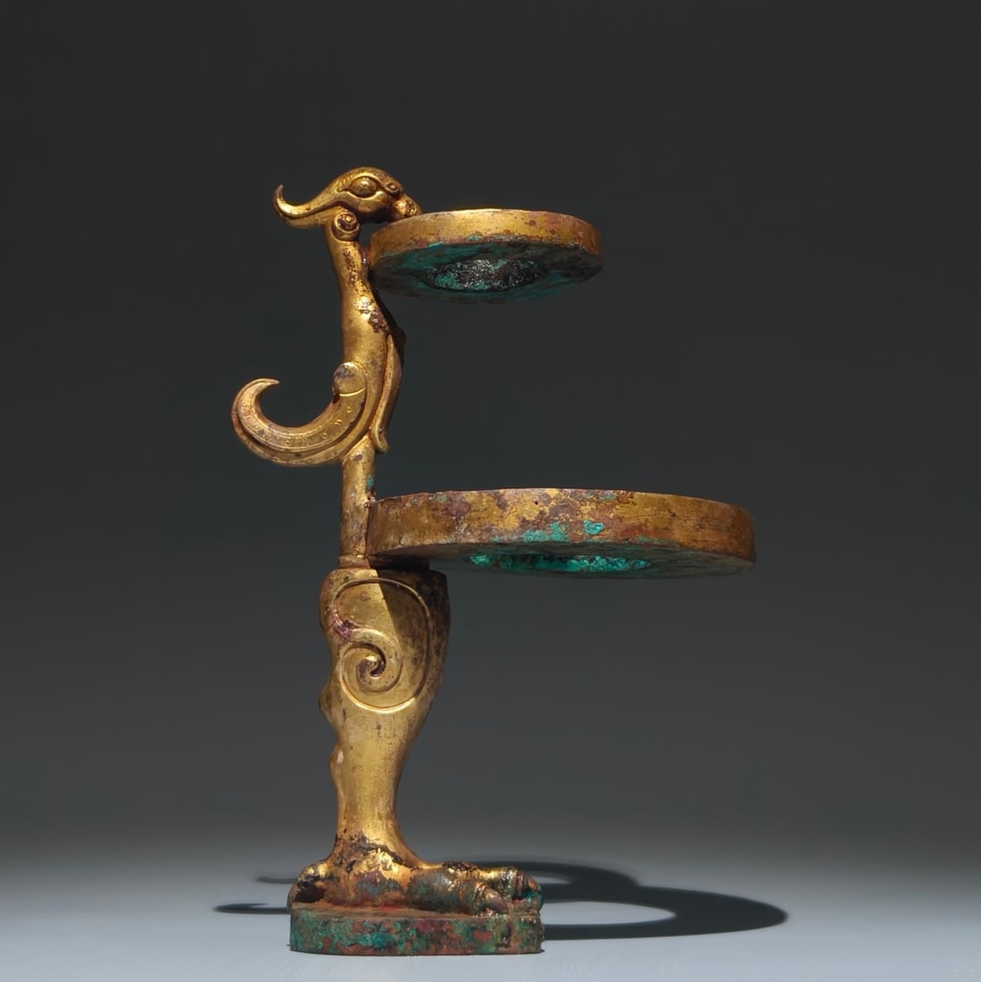 An Exquisite Gilt Bronze Phoenix-Shaped Candlestick: An Exquisite Gilt Bronze Phoenix-Shaped Candlestick,Han Dynasty, China,Size:9.4inx6.3inx4.7in 铜鎏金凤形烛台,中国汉代