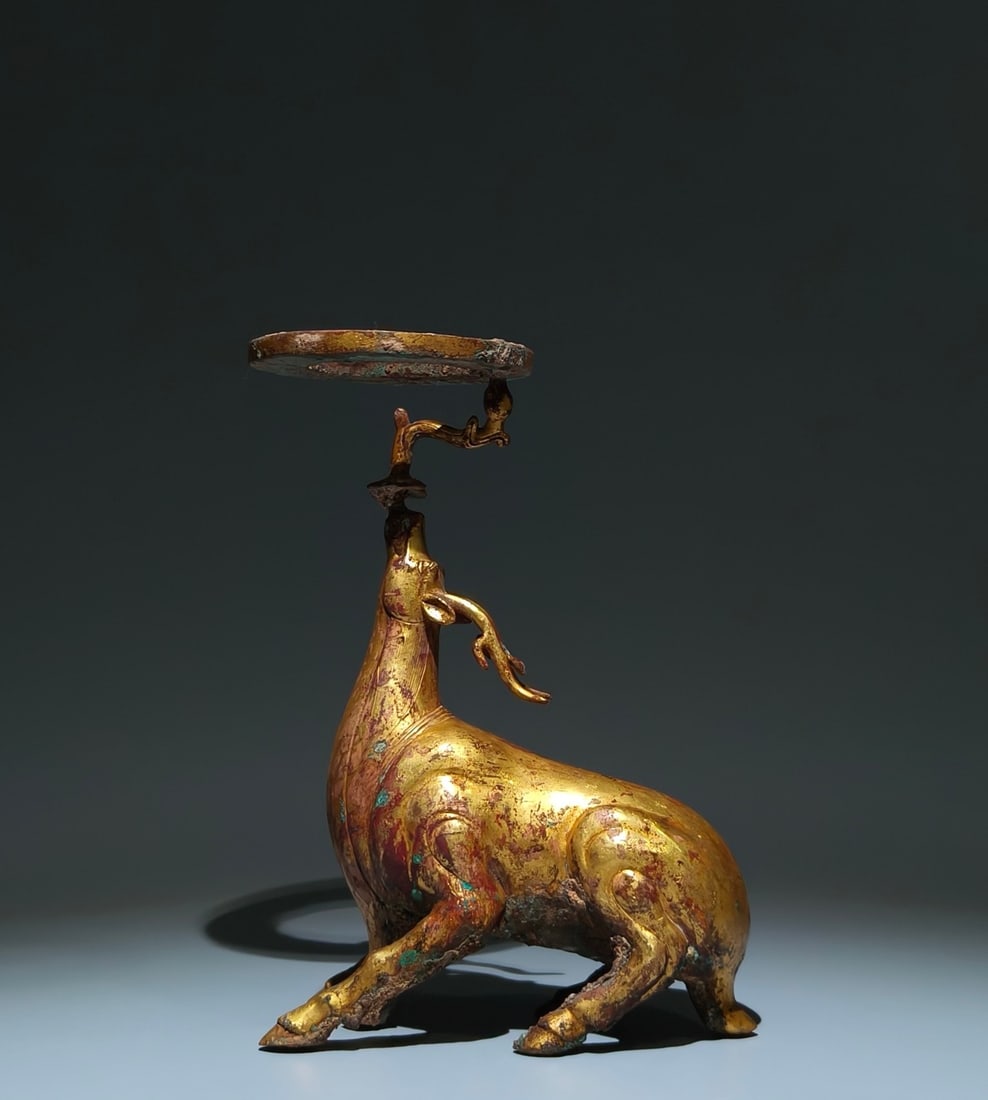 An Exquisite Gilt Bronze Sika Deer-Shaped Candlestick: An Exquisite Gilt Bronze Sika Deer-Shaped Candlestick,Han Dynasty, China,Size:11inx7.5inx3.5in 