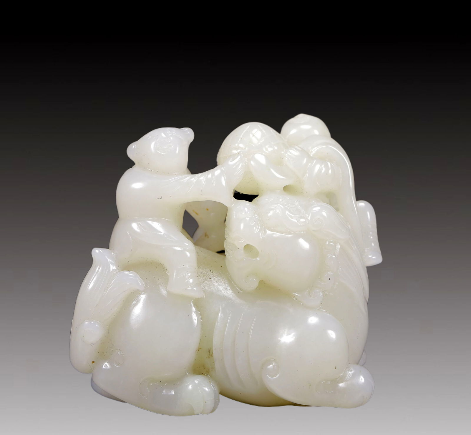An Exquisite White Jade Figure and Lion Ornament: An Exquisite White Jade Figure and Lion Ornament,Qing Dynasty, China,Size:2.8inx2inx2.8in,Weight:325g 白玉双人戏狮摆件，清代