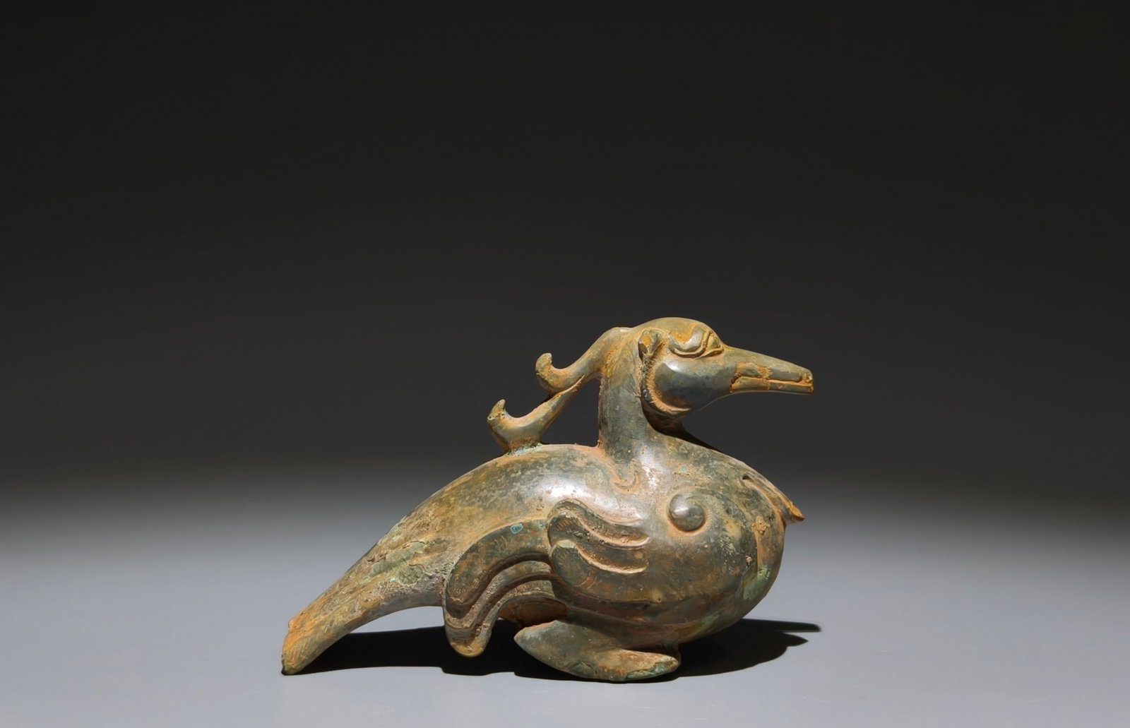 An Archaic Bronze Bird-Shaped Zun: An Archaic Bronze Bird-Shaped Zun,Han Dynasty, China,Size:3.5inx5.3inx2.2in 青铜鸟形尊,中国汉代