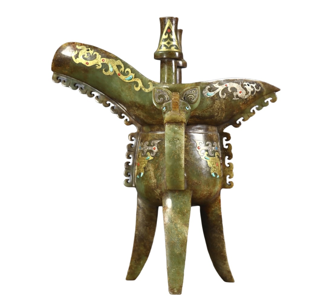 An Exquisite White Jade Inlaid Gold and Silver Beast-Face Pattern Tripod Goblet: An Exquisite White Jade Inlaid Gold and Silver Beast-Face Pattern Tripod Goblet,the Warring States period in China,Size:9.1inx7.5inx4.9in,Weight:940g 