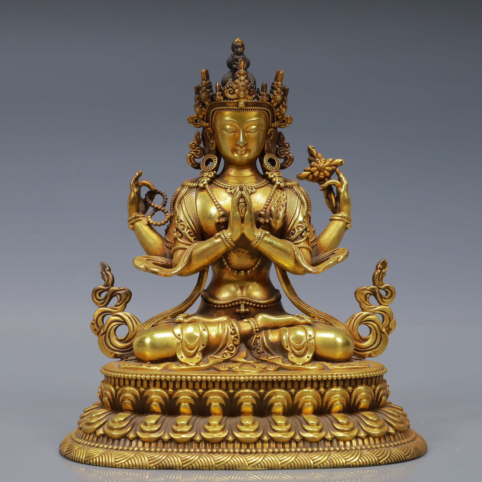 An Exquisite Gilt Bronze Statue of Four-Armed Guanyin: An Exquisite Gilt Bronze Statue of Four-Armed Guanyin,Ming Dynasty, China,Yongle Six-character Mark,Size:5.1inx3.9inx5.9in,Weight:1500g 
