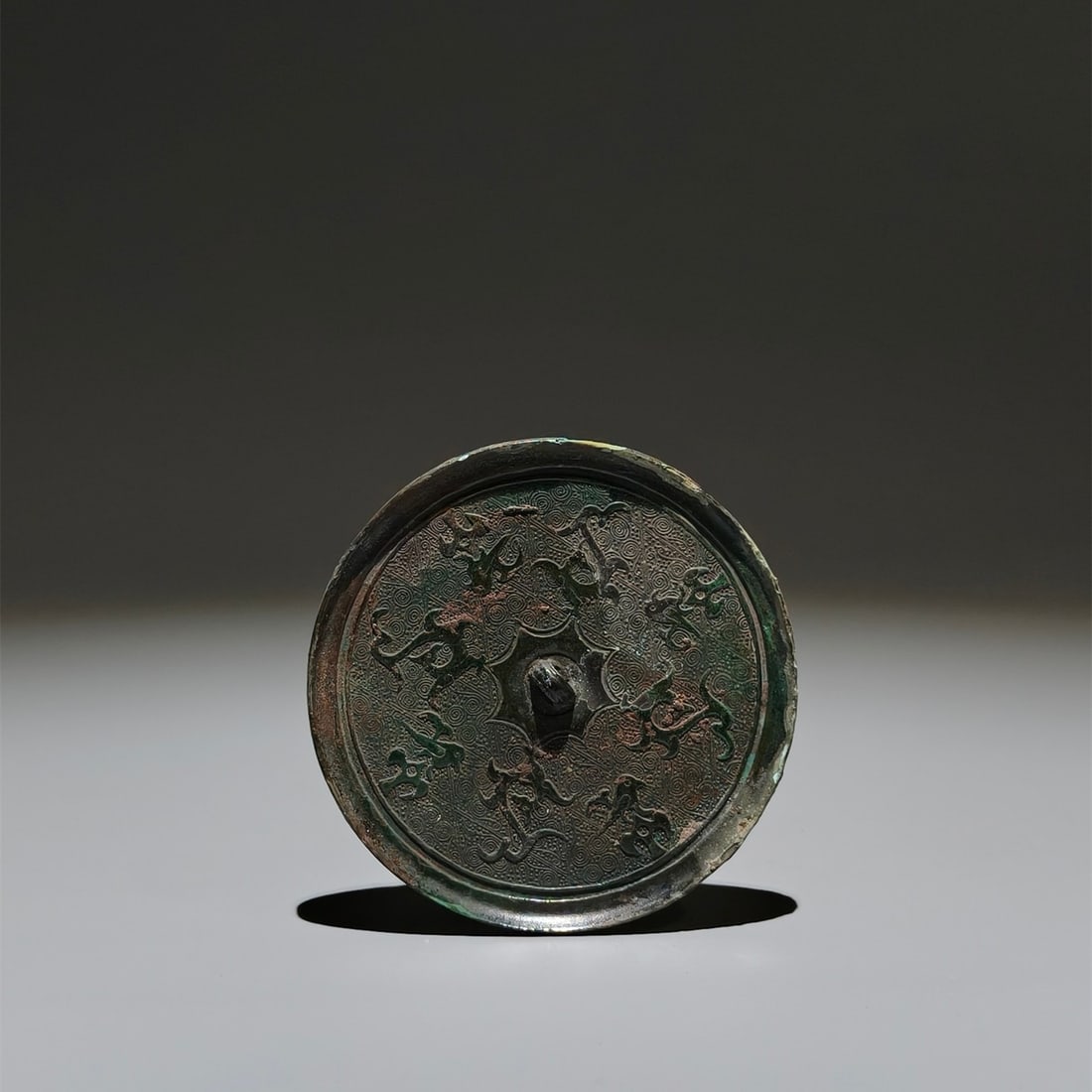 An Archaic Bronze Bird Pattern Round Mirror: An Archaic Bronze Bird Pattern Round Mirror,the Warring States period in China,Size:3.5in 青铜鸟纹圆镜,中国战国时期