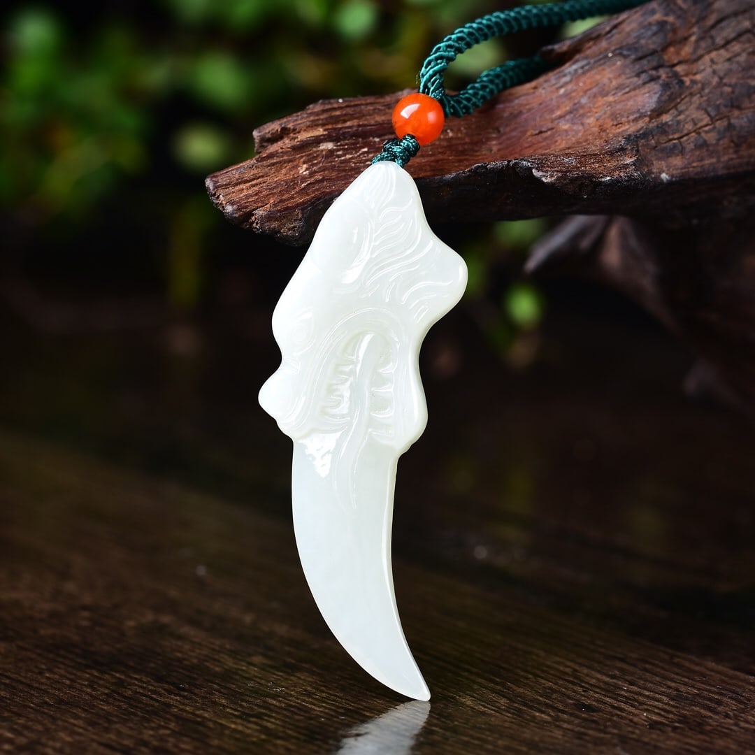 An Exquisite White Jade Pendant: An Exquisite White Jade Pendant,Size:21mmx64mm 寓意:招财.纳福.辟邪.免灾,代表吉祥有福有财 