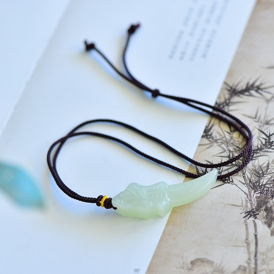 An Exquisite White Jade Pendant: An Exquisite White Jade Pendant,Size:52mmx17mm 寓意:招财.纳福.辟邪.免灾,代表吉祥有福有财 