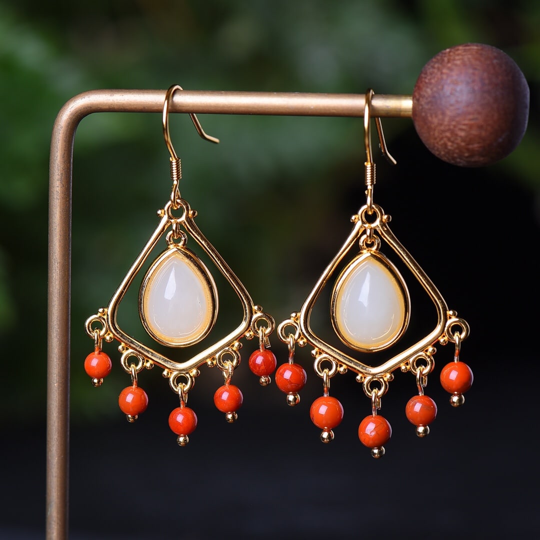 A Pair of Exquisite Sterling Silver-Gold Plated Inlaid White Jade Earrings: A Pair of Exquisite Sterling Silver-Gold Plated Inlaid White Jade Earrings,Size:8mmx11mm 一对纯银镀金镶白玉耳环
