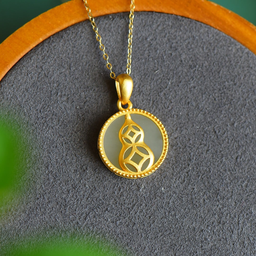 An Exquisite Sterling Silver-Gold Plated Inlaid White Jade Pendant: An Exquisite Sterling Silver-Gold Plated Inlaid White Jade Pendant 纯银镀金镶白玉吊坠