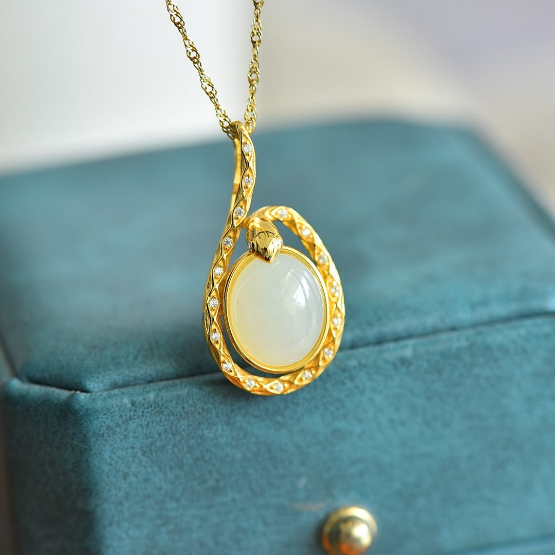 An Exquisite Sterling Silver-Gold Plated Inlaid White Jade Pendant: An Exquisite Sterling Silver-Gold Plated Inlaid White Jade Pendant,Size:10mmx12mm 纯银镀金镶白玉吊坠