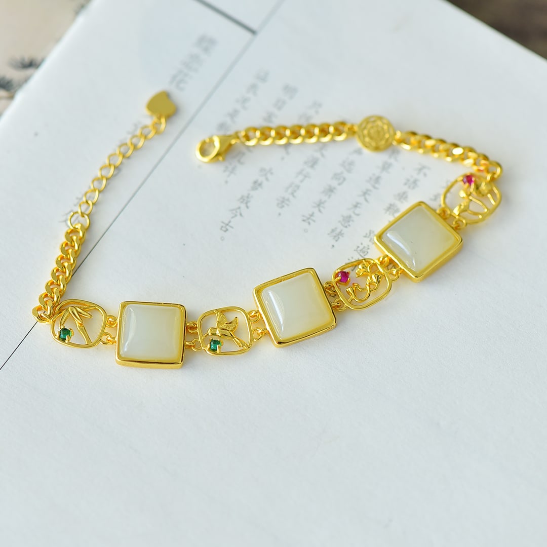 An Exquisite Sterling Silver-Gold Plated Inlaid White Jade Bracelet: An Exquisite Sterling Silver-Gold Plated Inlaid White Jade Bracelet 纯银镀金镶白玉手链