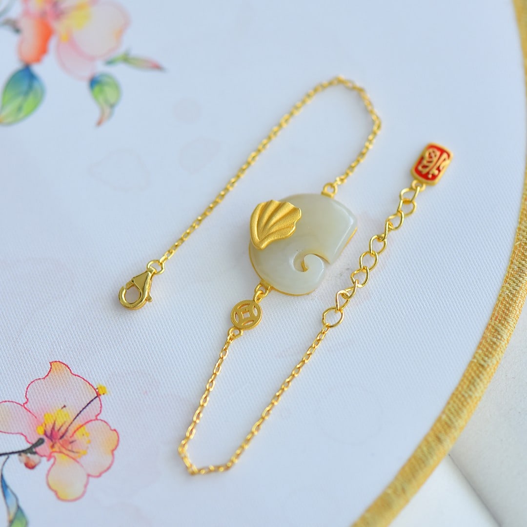 An Exquisite Sterling Silver-Gold Plated Inlaid White Jade Bracelet: An Exquisite Sterling Silver-Gold Plated Inlaid White Jade Bracelet 纯银镀金镶白玉手链